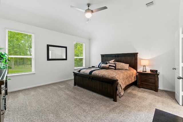 bedroom featuring baseboards, visible vents, ceiling fan, and carpet
