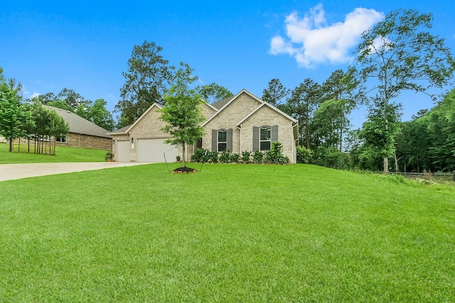 view of front of house featuring brick siding, a garage, a front lawn, and driveway