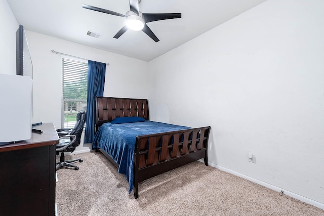 carpeted bedroom with baseboards, ceiling fan, and visible vents