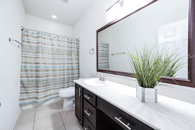 full bath with vanity, tile patterned floors, toilet, and shower / tub combo