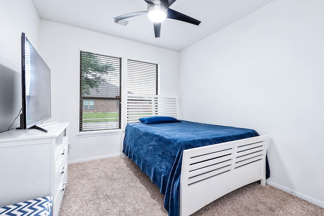 bedroom with baseboards, carpet flooring, ceiling fan, and visible vents