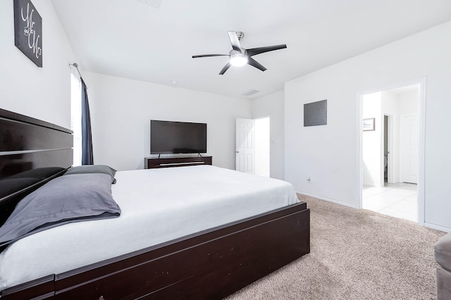 bedroom featuring baseboards, light carpet, and a ceiling fan