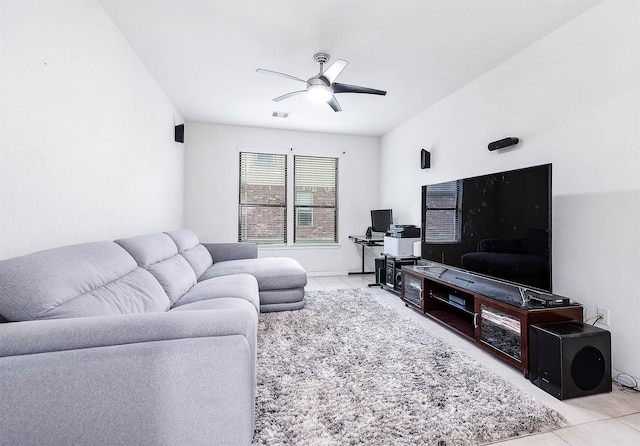 living room featuring visible vents, ceiling fan, and tile patterned floors