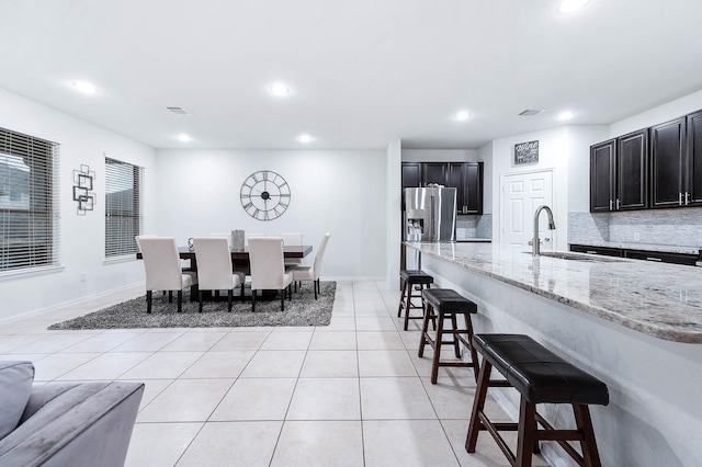 interior space with light tile patterned floors, baseboards, recessed lighting, and visible vents