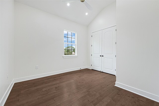 203 Dwire Dr, La Porte, TX 77571 - unfurnished bedroom featuring baseboards, dark wood finished floors, and lofted ceiling