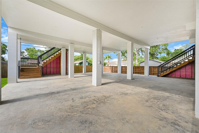 203 Dwire Dr, La Porte, TX 77571 - view of patio / terrace featuring concrete driveway, fence, stairs, and a carport