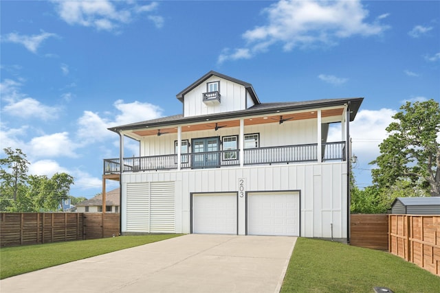 203 Dwire Dr, La Porte, TX 77571 - view of front facade with driveway, a ceiling fan, a front yard, and a garage