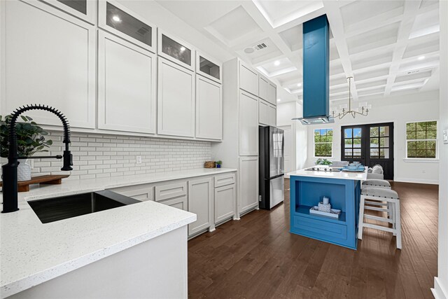 203 Dwire Dr, La Porte, TX 77571 - kitchen featuring beam ceiling, a sink, freestanding refrigerator, dark wood-type flooring, and backsplash