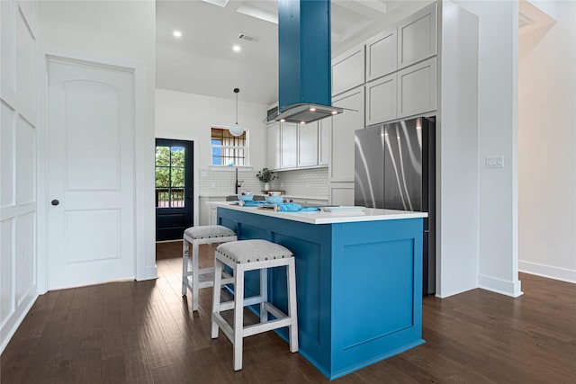 203 Dwire Dr, La Porte, TX 77571 - kitchen with a center island, light countertops, dark wood-style flooring, and island range hood