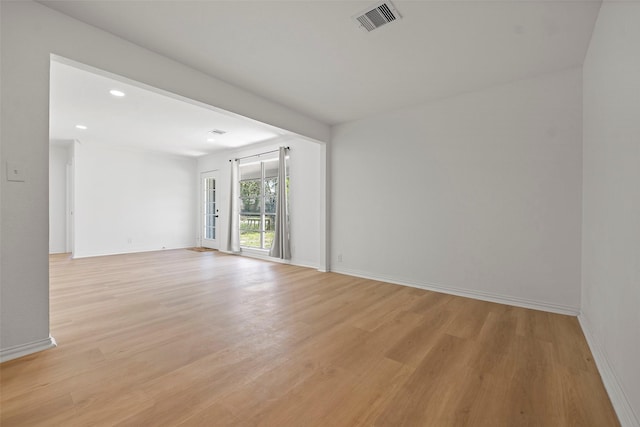 7817 Woodlyn Rd, Houston, TX 77028 - spare room featuring light wood finished floors, baseboards, and recessed lighting