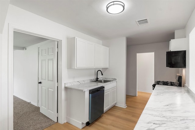 7817 Woodlyn Rd, Houston, TX 77028 - kitchen with black appliances, a sink, light countertops, and light wood-style floors