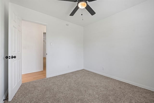 7817 Woodlyn Rd, Houston, TX 77028 - spare room with light carpet, a ceiling fan, and baseboards