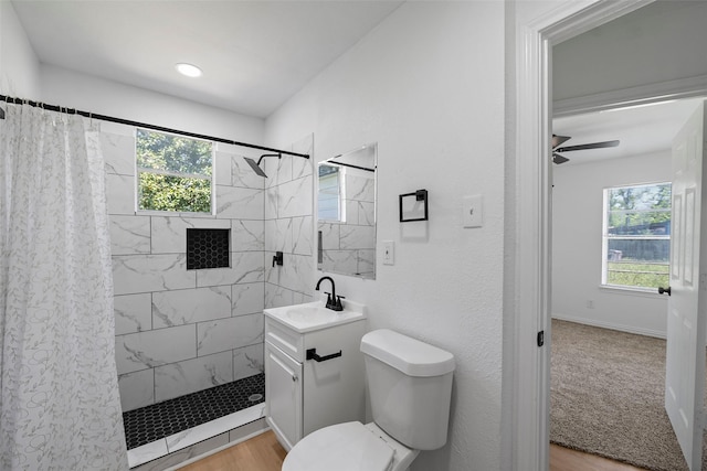 7817 Woodlyn Rd, Houston, TX 77028 - full bath featuring tiled shower, plenty of natural light, vanity, and toilet