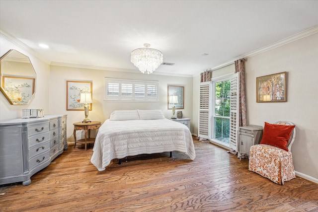 bedroom with a chandelier, access to exterior, baseboards, wood finished floors, and ornamental molding
