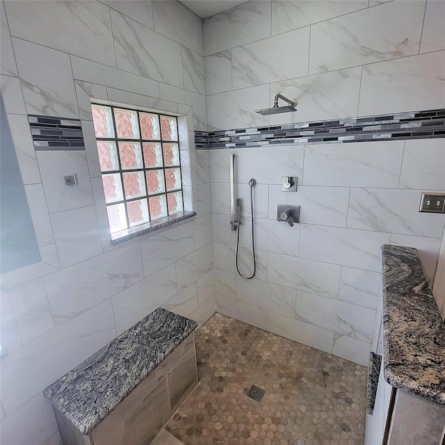 full bathroom featuring a tile shower