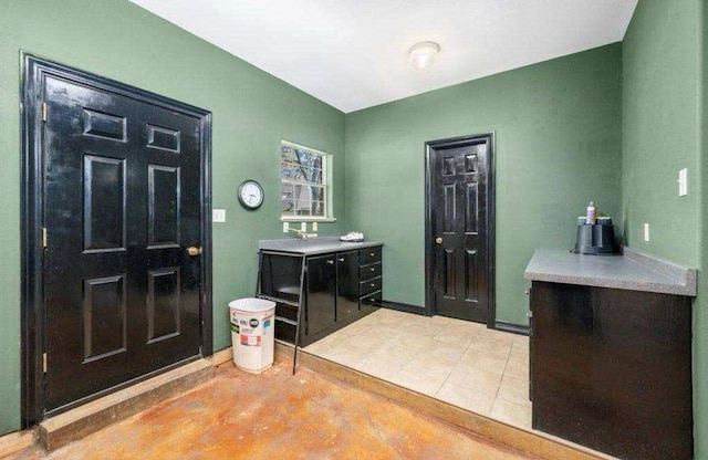 bathroom featuring tile patterned flooring and baseboards