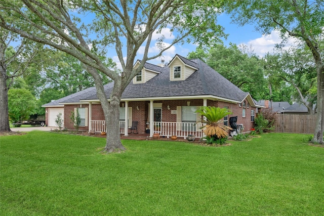 cape cod house with covered porch, roof with shingles, brick siding, fence, and a front lawn