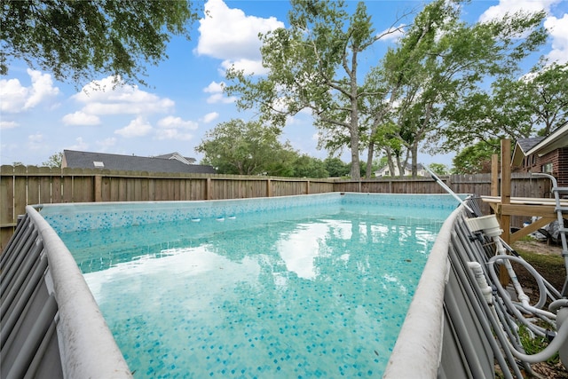 view of swimming pool featuring a fenced in pool and a fenced backyard