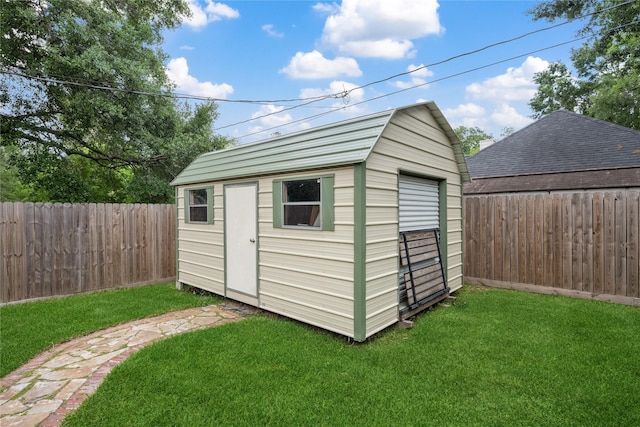 view of shed with a fenced backyard