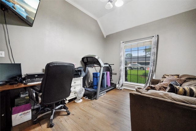 home office featuring ornamental molding, wood finished floors, and lofted ceiling