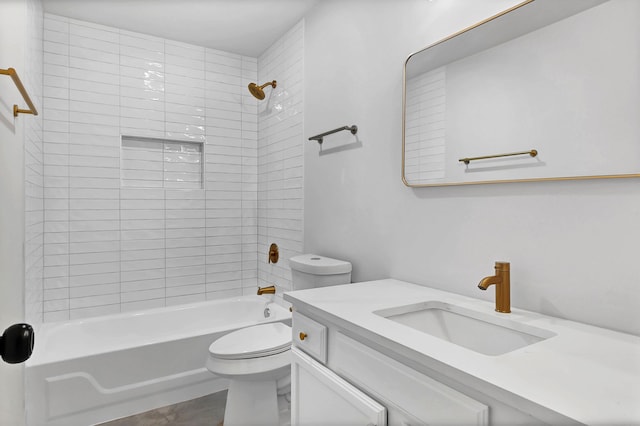bathroom with vanity, bathtub / shower combination, and toilet