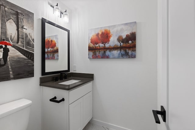 208 S Empress Green Pl, Montgomery, TX 77316 - bathroom featuring vanity, baseboards, toilet, and marble finish floor