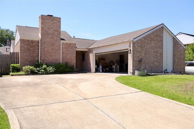 12835 Ashford Chase Dr, Houston, TX 77082 - ranch-style home featuring a chimney, a garage, brick siding, concrete driveway, and a shingled roof
