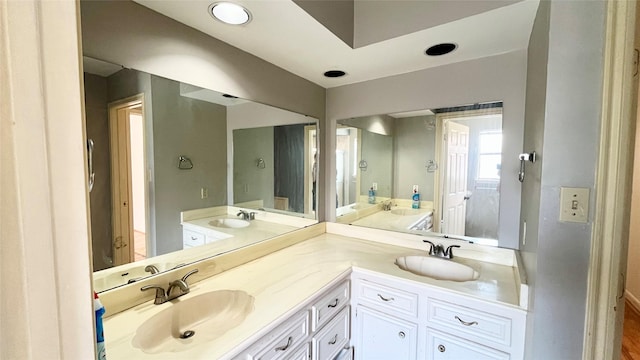 12835 Ashford Chase Dr, Houston, TX 77082 - full bathroom featuring double vanity, a sink, and recessed lighting