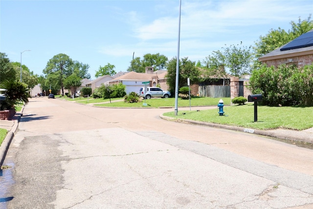 12835 Ashford Chase Dr, Houston, TX 77082 - view of street with a residential view, curbs, and street lights