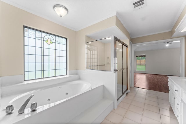 bathroom with visible vents, crown molding, tile patterned flooring, a jetted tub, and a shower stall