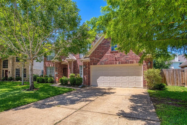 traditional-style house with brick siding, driveway, and a garage