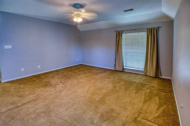empty room featuring ceiling fan, carpet floors, baseboards, and a textured ceiling