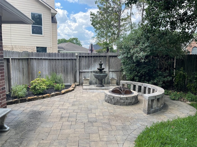 6505 River Glen Ct, Pearland, TX 77584 - fenced backyard featuring a patio area and an outdoor fire pit