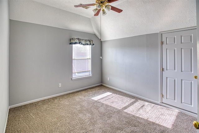 6505 River Glen Ct, Pearland, TX 77584 - carpeted spare room featuring a textured ceiling, vaulted ceiling, and ceiling fan