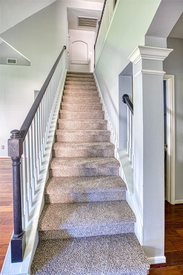 6505 River Glen Ct, Pearland, TX 77584 - stairs with wood finished floors and decorative columns