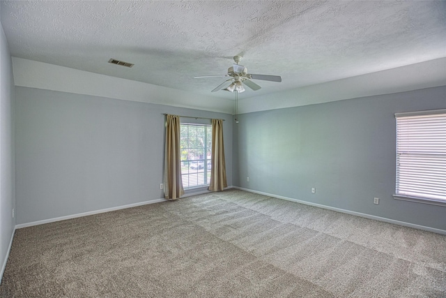 6505 River Glen Ct, Pearland, TX 77584 - carpeted spare room featuring a ceiling fan and a textured ceiling