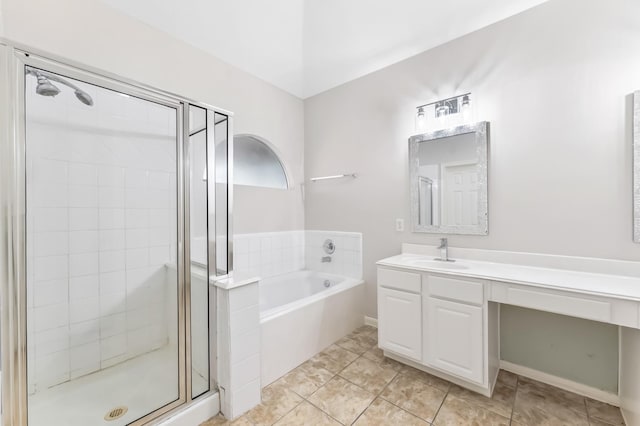 bathroom with vanity, tile patterned floors, a bath, and a shower stall