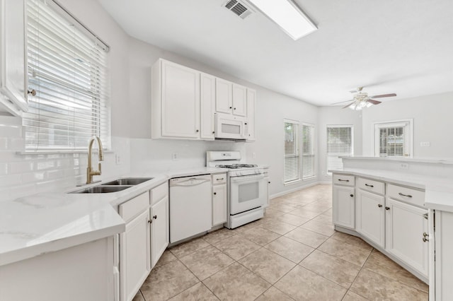 kitchen with ceiling fan, a sink, white cabinets, white appliances, and light tile patterned flooring
