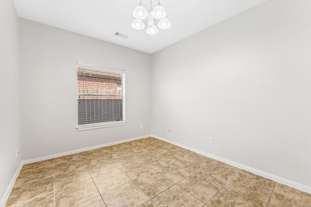 spare room with light tile patterned flooring, a notable chandelier, visible vents, and baseboards