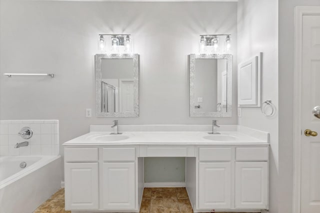 bathroom featuring double vanity, a sink, and a bath