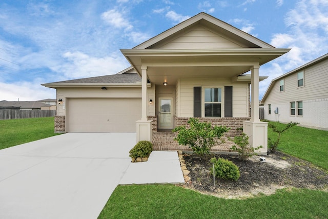 view of front of property featuring fence, an attached garage, a front lawn, brick siding, and concrete driveway