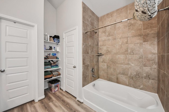 full bath featuring shower / tub combination and wood finished floors