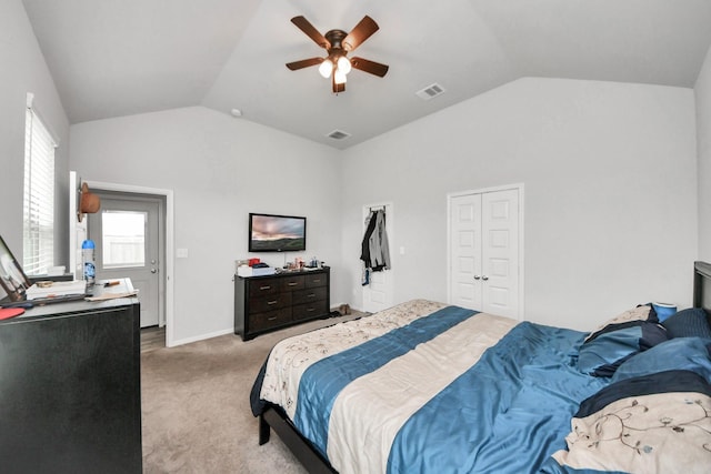 bedroom featuring a ceiling fan, vaulted ceiling, light carpet, and visible vents