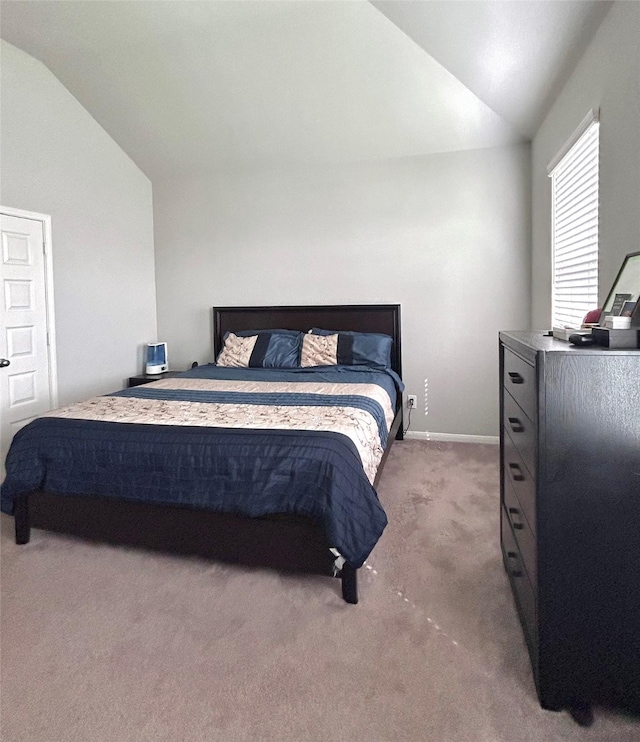 503 Thunder Cloud Dr, Baytown, TX 77523 - carpeted bedroom featuring vaulted ceiling and baseboards