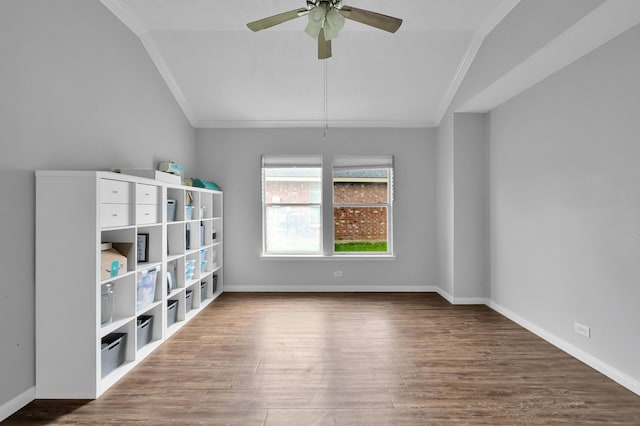 unfurnished room with crown molding, ceiling fan, wood finished floors, and lofted ceiling