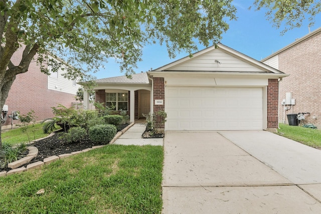 ranch-style house with brick siding, an attached garage, and driveway