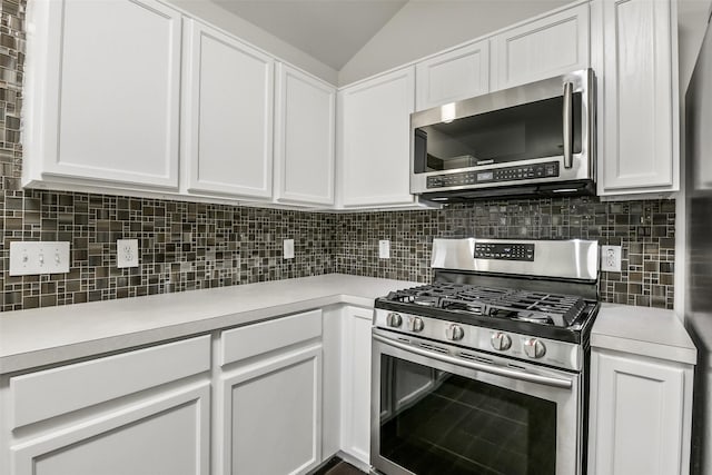 kitchen with light countertops, stainless steel appliances, and white cabinetry