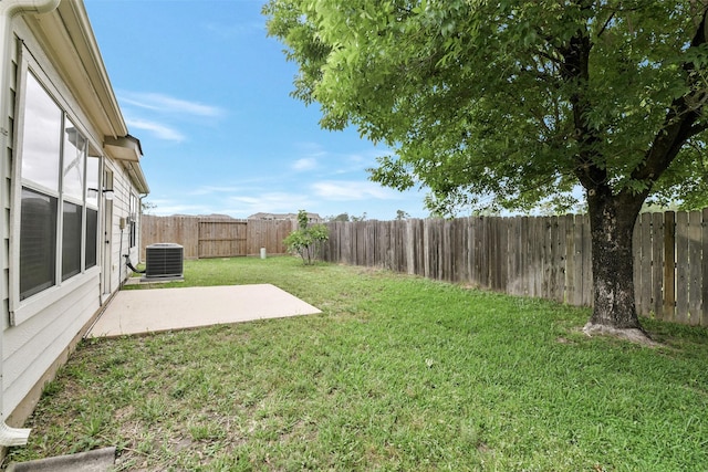 view of yard featuring a patio, cooling unit, and a fenced backyard