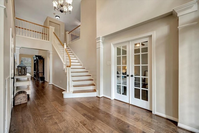 13538 Scenic Glade Dr, Houston, TX 77059 - foyer entrance featuring french doors, wood finished floors, stairs, a towering ceiling, and a chandelier