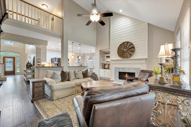 13538 Scenic Glade Dr, Houston, TX 77059 - living area featuring high vaulted ceiling, a ceiling fan, healthy amount of natural light, wood-type flooring, and a tile fireplace